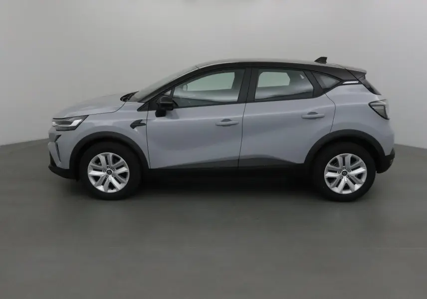 Renault Captur 2025 gris Rafale avec toit noir, vue profil côté gauche, lignes modernes et jantes alliage.
