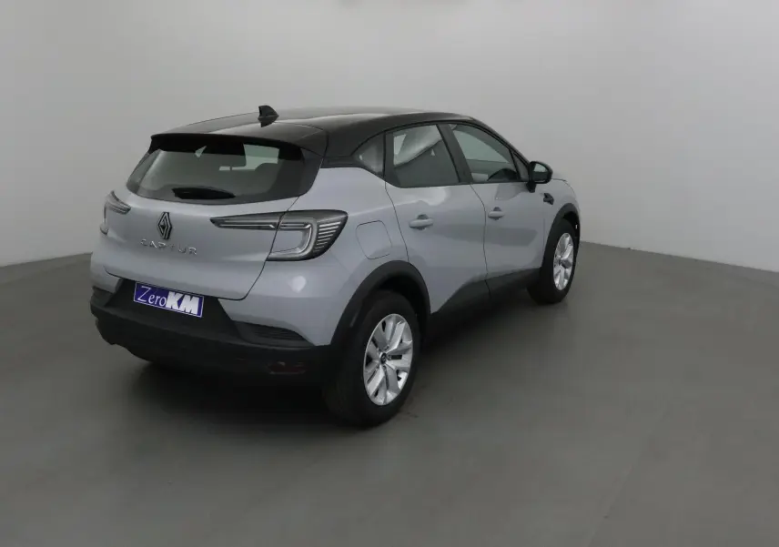 Renault Captur 2025 gris Rafale avec toit noir, vue 3/4 arrière droit dans un studio neutre.