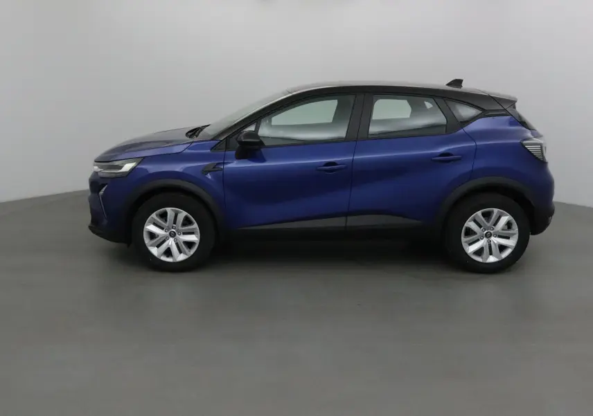 Profil côté gauche du Renault Captur 1.0 TCE 90 Evolution 2025 en bleu iron avec toit noir contrasté.