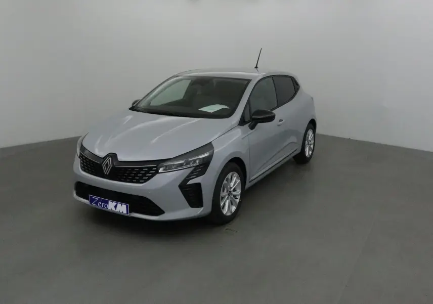 Renault Clio V gris Rafale vue 3/4 avant droit, avec calandre noire et jantes alliage 16 pouces.