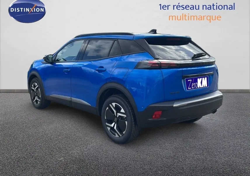 Peugeot 2008 bleu Vertigo métal en 3/4 arrière droit, avec jantes bi-ton et toit noir contrasté.