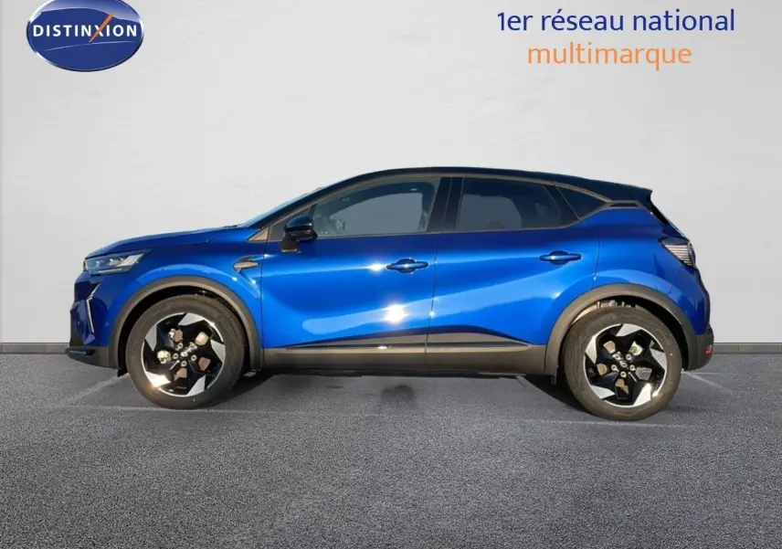 Profil droit d'un Renault Captur 2025 bleu Iron Metal avec toit noir et jantes alliage bicolores.
