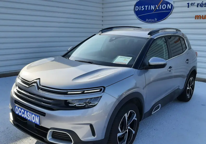 Citroën C5 Aircross gris Artense vue 3/4 avant droit avec jantes noires et toit noir contrasté.