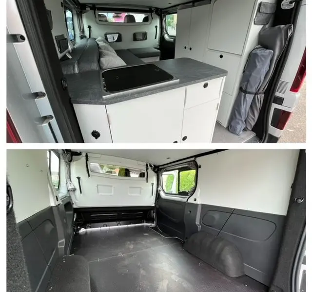 Intérieur arrière du Renault Trafic gris Comète aménagé en van, avec cuisine et rangements visibles côté droit.