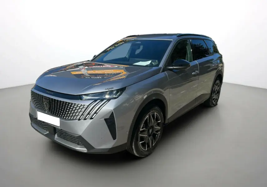 Peugeot 5008 Hybrid gris artense vue 3/4 avant avec calandre distinctive et jantes alu 19 pouces.