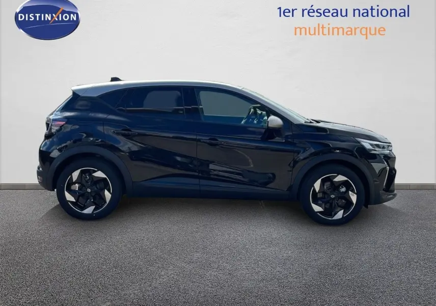 Profil côté gauche du Renault Captur 2025 noir étoile métal avec toit gris, jantes bi-ton et vitres teintées.
