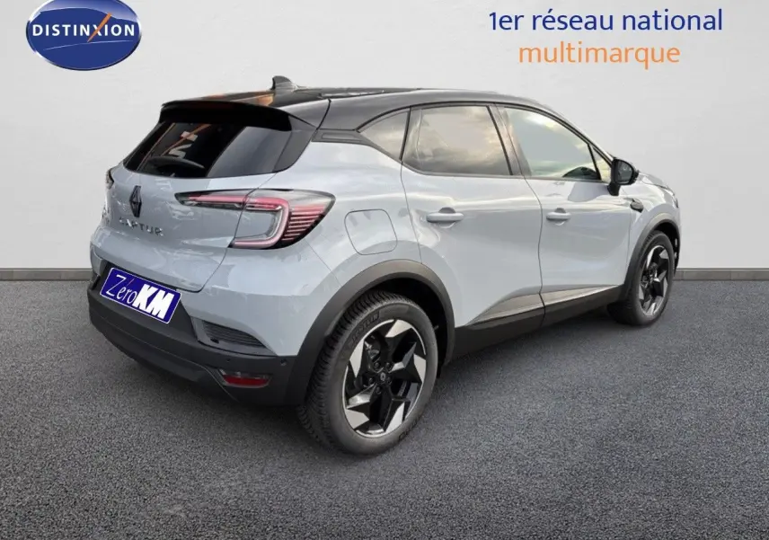 Renault Captur II hybride gris Rafale avec toit noir, vue 3/4 arrière droit mettant en valeur ses jantes noires.
