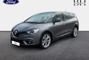 Renault Grand Scenic gris Cassiopée en 3/4 avant droit, avec jantes alu et vitres arrière surteintées.