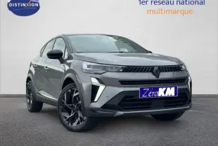 Renault Captur 1.8 E-Tech hybride 2026 gris Cassiopée/noir, vue 3/4 avant avec signature lumineuse distinctive.