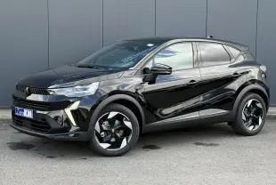 Renault Captur 2026 noir étoilé en 3/4 avant droit, avec jantes aluminium noires et détails modernes lumineux.