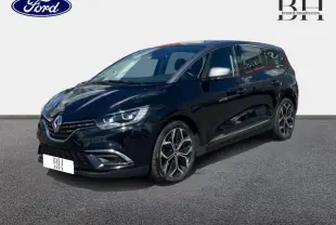 Renault Grand Scenic noir étoilé en 3/4 avant droit, avec jantes alliage 20 pouces et feux LED distinctifs.