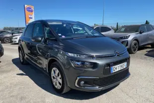 Citroën C4 Picasso gris shark vue 3/4 avant droit, avec feux LED et jantes alliage 16 pouces visibles.