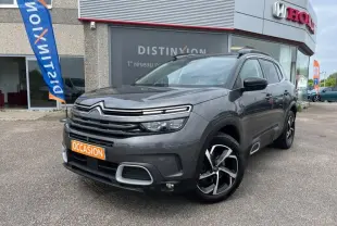 Citroën C5 Aircross gris acier vue 3/4 avant droit avec calandre noire et jantes alliage bicolores.