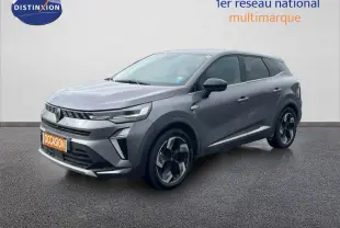 Renault Symbioz gris cassiopée métal en 3/4 avant droit, SUV hybride avec jantes bi-ton et calandre moderne.
