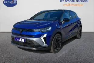 Renault Captur E-Tech hybride 2025 bleu Iron Metal avec toit noir, vue 3/4 avant mettant en valeur ses jantes noires.