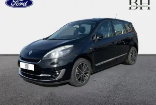 Renault Grand Scenic noir étoilé en 3/4 avant droit, avec jantes alu et lignes chromées sur les flancs.