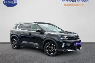 Citroën C5 Aircross noir Perla Nera vue 3/4 avant droit avec jantes alu et barres de toit visibles.