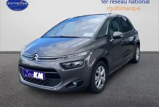 Citroën C4 Picasso gris vue 3/4 avant droit sur fond neutre avec phares et calandre distinctifs.