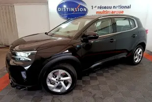 Vue 3/4 avant droit d’un Citroën C5 Aircross hybride rechargeable noir, avec jantes alliage et logo H bleu sur aile.