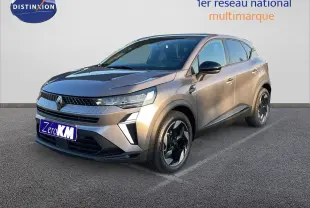 Renault Captur E-Tech hybride gris cassiopée métal, vue 3/4 avant droit avec jantes noires bicolores.