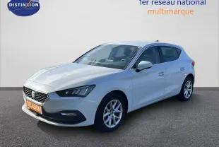 SEAT Leon 2.0 TDI blanc neige vue 3/4 avant droit avec jantes alliage et calandre distinctive.