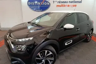 Citroën C3 PureTech 110 noir vue 3/4 avant droit avec toit et rétroviseurs blancs, détails Airbump latéraux visibles.
