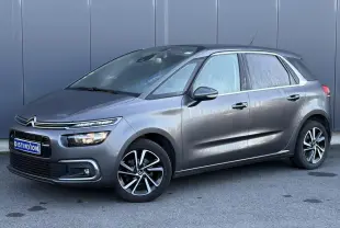 Citroën C4 Picasso gris Platinium vue 3/4 avant droit avec jantes alliage bi-ton et feux LED distinctifs.