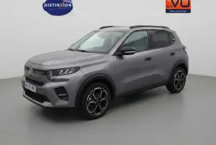 Citroën C3 gris vue 3/4 avant droit avec jantes alliage 17 pouces et barres de toit visibles.