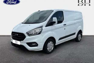 Vue 3/4 avant droit d'un Ford Transit Custom blanc Glacier avec calandre noire et jantes acier.