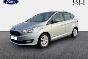 Ford C-MAX gris lunaire en vue 3/4 avant droit, mettant en valeur sa calandre noire et ses jantes à enjoliveurs.