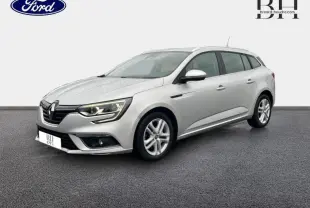 Renault Mégane Break gris platine vue 3/4 avant droit, avec feux LED et jantes alliage visibles.