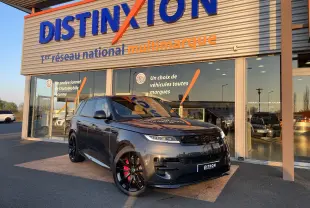 Range Rover Sport P440 HSE R-Dynamic gris Carpathian, vue 3/4 avant, jantes noires 23'', étriers rouges visibles.