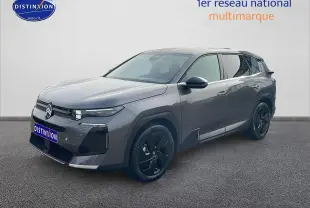 Citroën C5 Aircross gris en 3/4 avant droit avec jantes noires et calandre moderne.