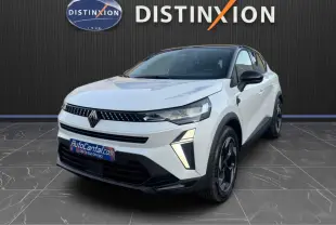 Renault Captur E-Tech blanc nacré toit noir en 3/4 avant droit, avec signature lumineuse LED distinctive.