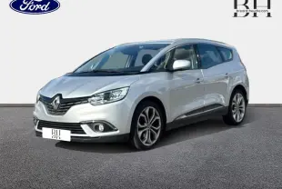 Renault Grand Scenic gris platine vu en 3/4 avant droit, avec jantes alliage et feux LED allumés.