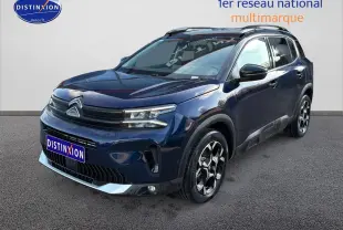 Citroën C5 Aircross bleu eclipse en 3/4 avant droit, avec jantes alu et détails noirs contrastants.