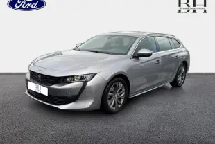 Peugeot 508 SW gris Platinium vue 3/4 avant droit avec calandre noire et jantes alliage visibles