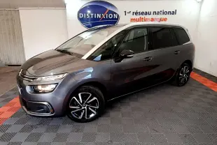Citroën Grand C4 Spacetourer gris foncé vu de 3/4 avant droit dans un showroom intérieur.