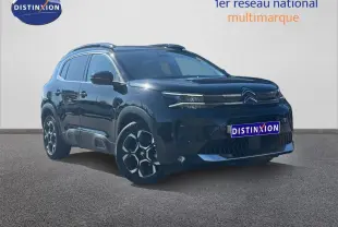 Citroën C5 Aircross noir Perla Nera vue 3/4 avant droit avec jantes alu et barres de toit visibles.