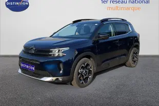 Vue 3/4 avant droit d'un Citroën C5 Aircross 2025 bleu Eclipse Metal avec jantes noires et détails argentés.