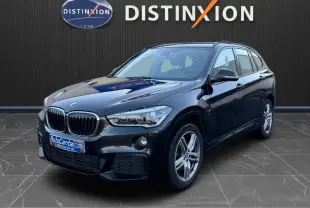 BMW X1 18D M Sport noir métal vue 3/4 avant, avec calandre double haricot et jantes alliage 18 pouces.