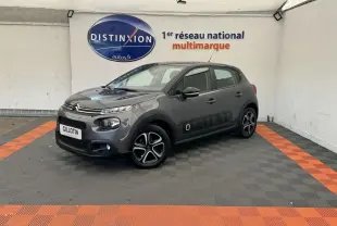 Citroën C3 gris foncé vue 3/4 avant droit, avec protections latérales Airbump et jantes spécifiques.